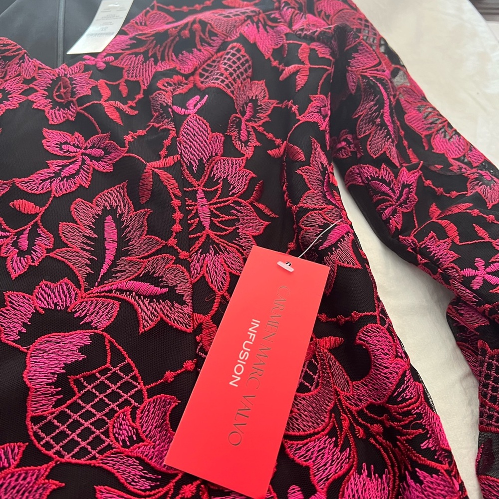 Beautiful red/pink and black dress with v neck and bell sleeves.nwt